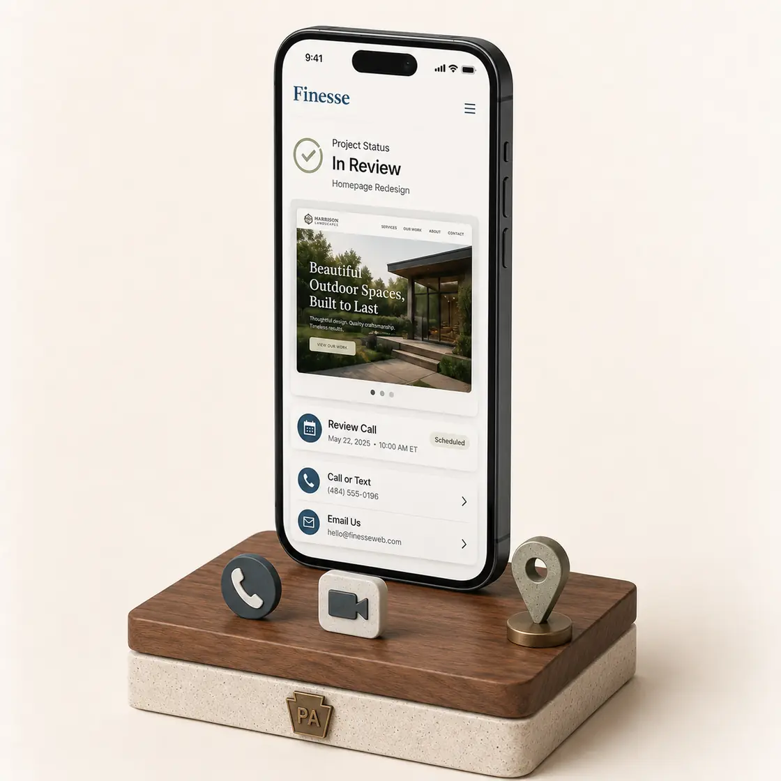A phone on a walnut and stone stand showing a Finesse project-status screen with a client homepage preview, a scheduled review call, and call and email links, beside phone, video call, and map-pin icons and a Pennsylvania keystone marker.