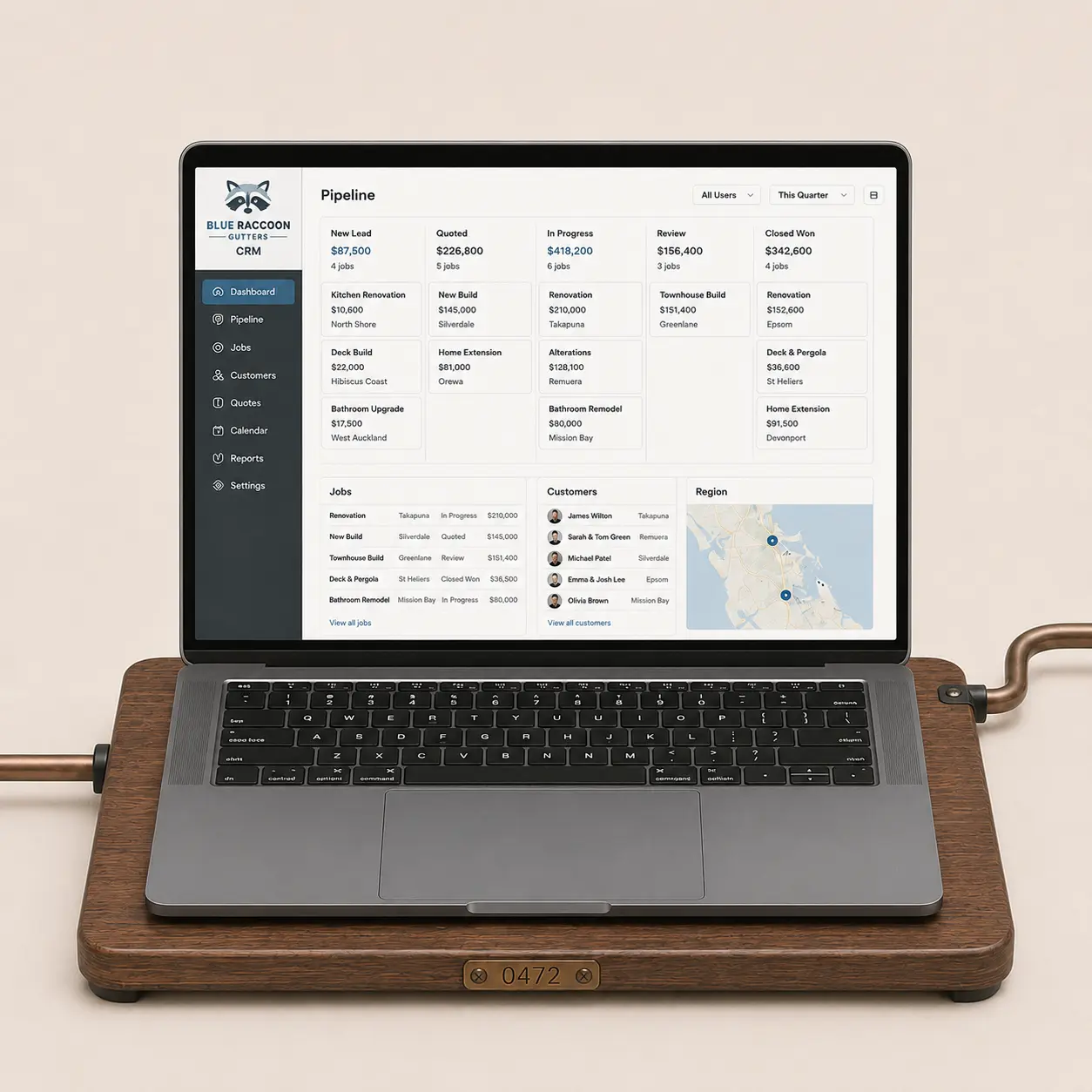 Blue Raccoon Gutters CRM displayed on a front-facing laptop seated on its fitted walnut workbase and connected by bronze conduit.