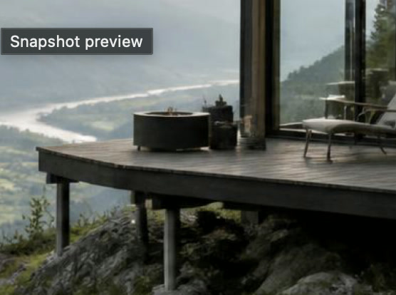 Close-up of the steel smokeless fire bowl on the Ridge deck, valley behind