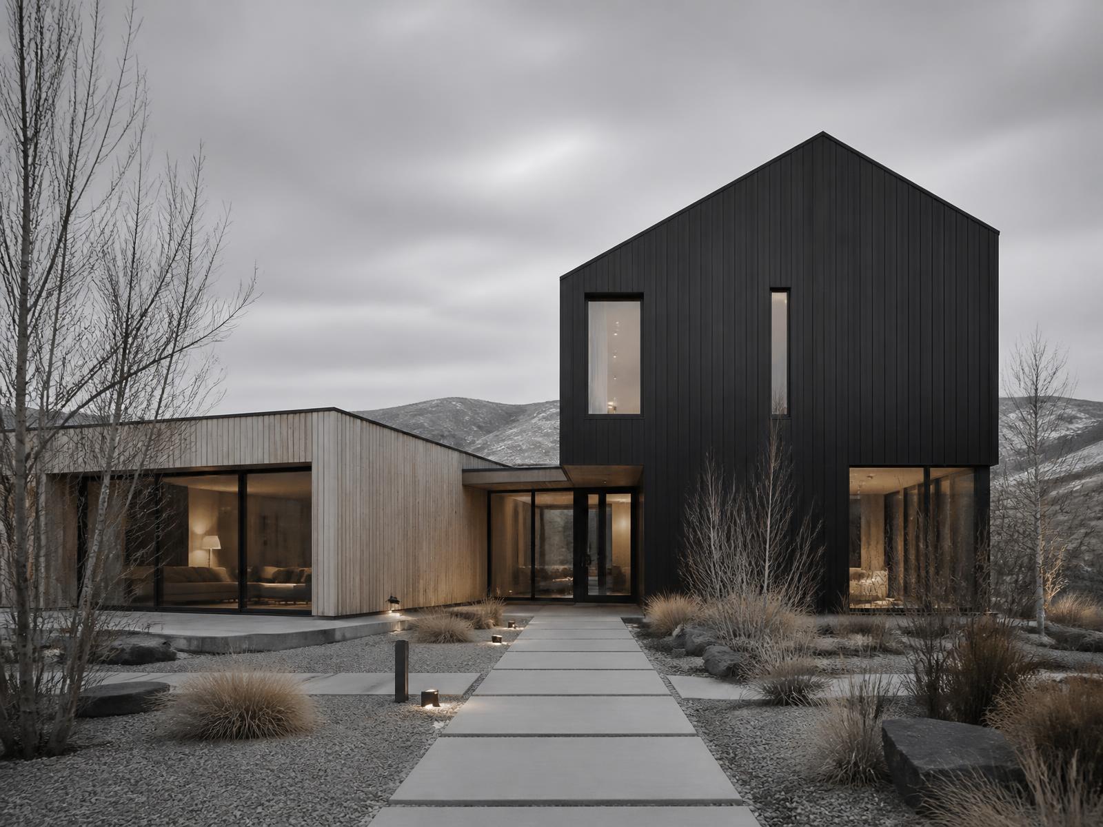 Contemporary home concept of two offset volumes in charcoal panel and warm wood with tall glazing, framed by golden aspens in early fall